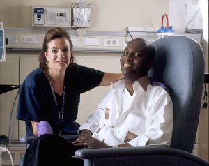 Nurse poses with cancer patient